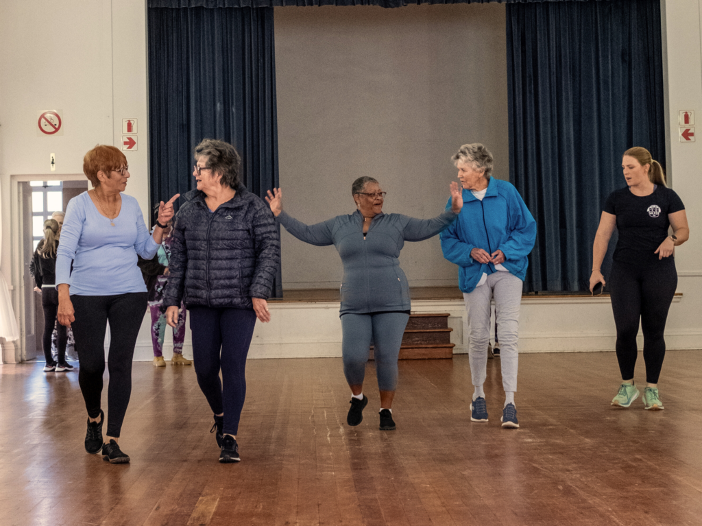 Small group exercise class for people over 60 focusing on mobility and balance.
