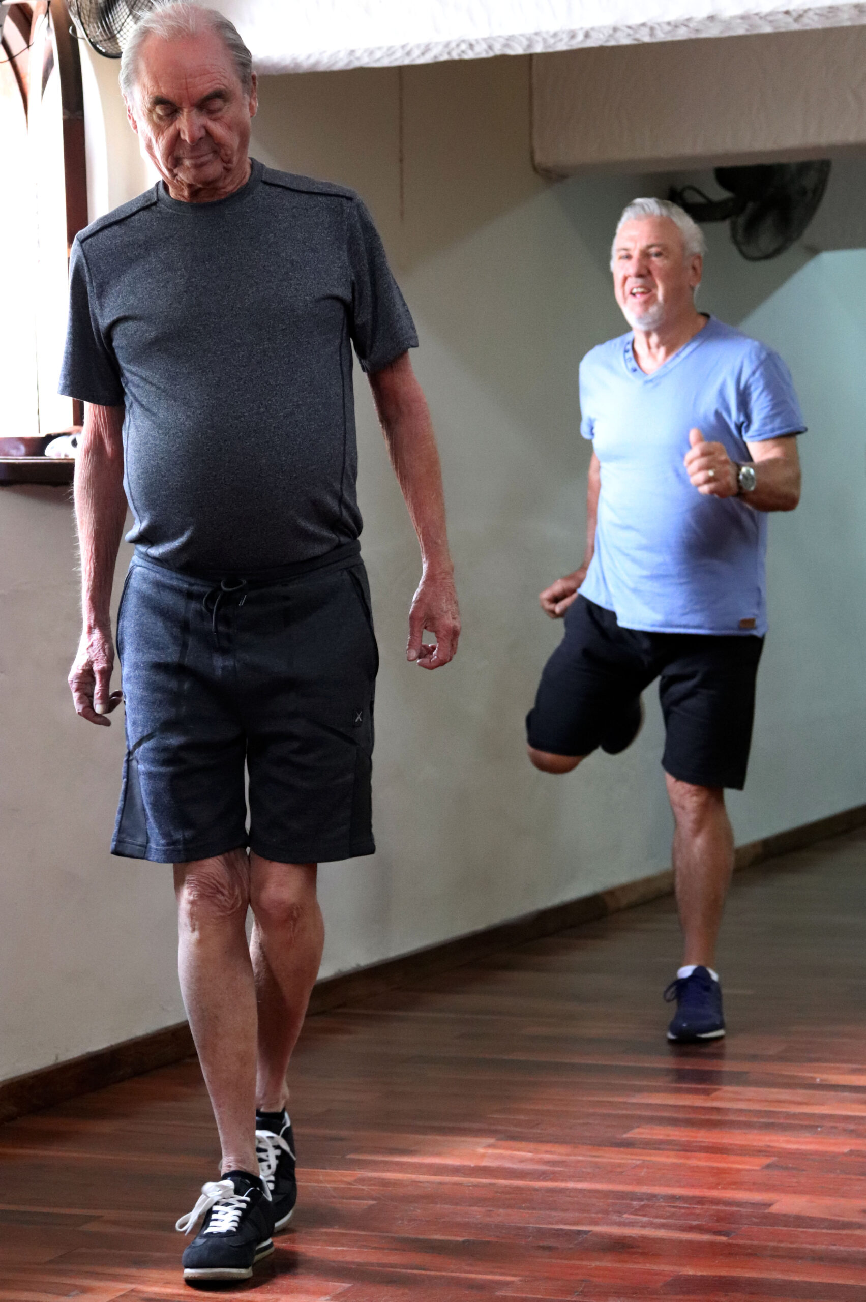 Older adults practising balance exercises during a Silver Fit class.