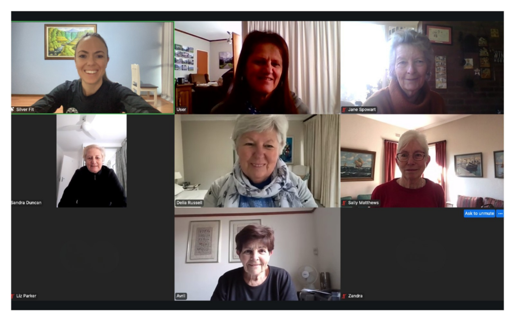 Older adults participating in a live online Silver Fit exercise class from home.